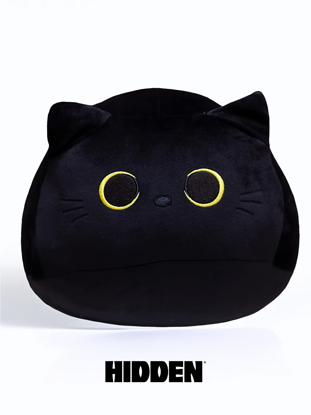 A plushie toy resembling a black cat with a cheeky expression, hidden in a playful pose.